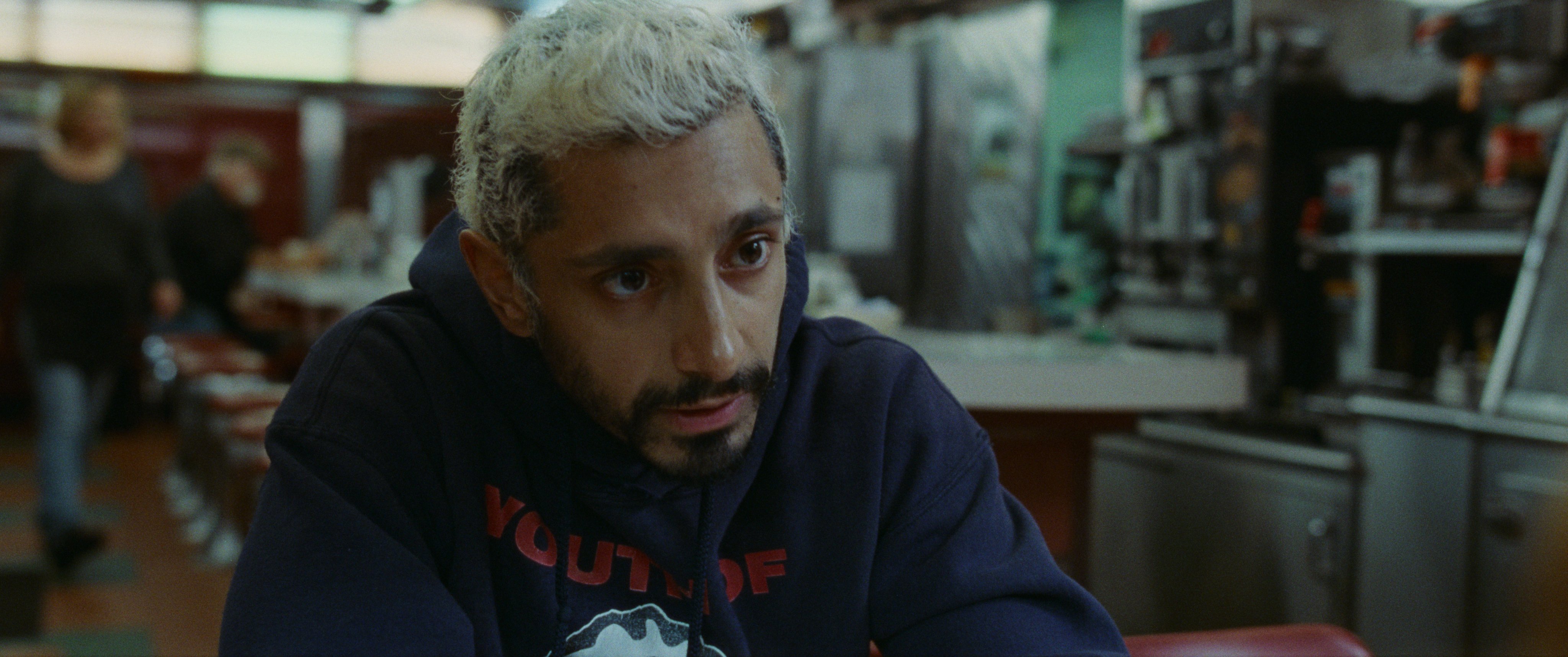 Ruben attentively pays attention in a deli