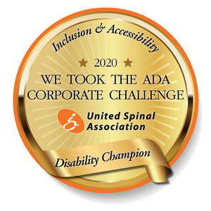 Corporate Challenge medallion showing text: Inclusion & Accessibility. 2020: We Took the ADA Corporate Challenge. United Spinal Association. Disability Champion.