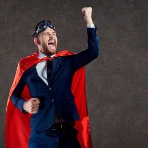 a-businessman-in-a-suit-with-a-red-superhero-cape