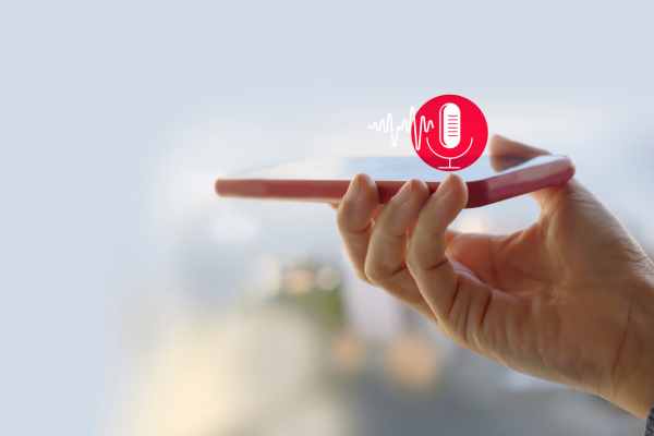 hand-holding-amobile-device-wuth-a-microphone-icon-and-soundwaves-above-it