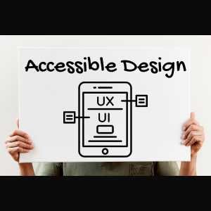 hands-holding-a-white-sign-with-the-words-accessible-design-written-on-it-with-a-tablet-drawing-and-web-elements-and-the-letters-ux-and-ui