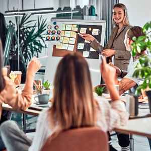 team-working-on-a-marketing-campaign-having-a-discusssion-and-brainstorming-ideas-on-sticky-notes