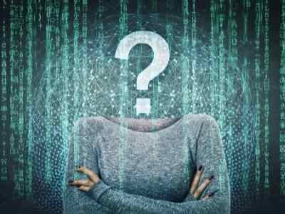 upper-body-in-a-gray-sweater-with-arms-crossed-and-a-question-mark-for-a-head-on-a-background-of-code