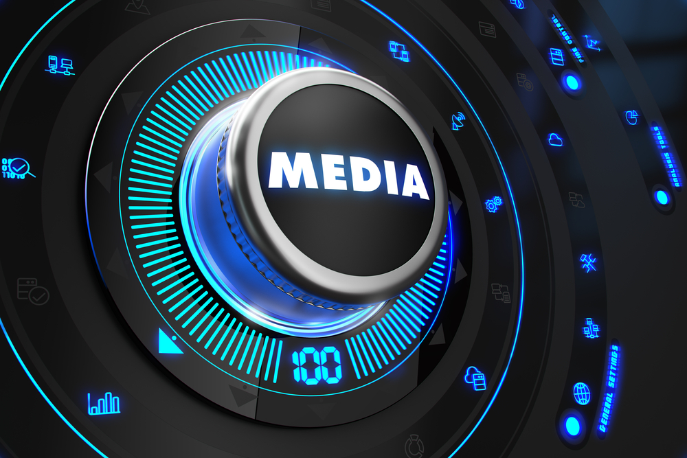 Media Button with Glowing Blue Lights on Black Console.